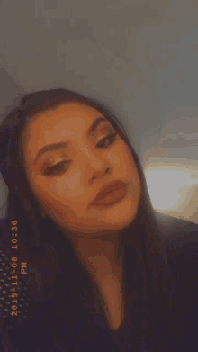 a woman is blowing a kiss in a photo that was taken on 11 08 2019