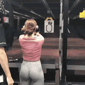 Pulling down her yoga pants at the shooting range