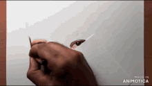 a drawing of a man 's eye is being made by animatica