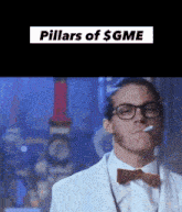 a man wearing glasses and a bow tie is smoking a cigarette and says pillars of $ gme