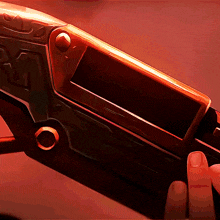 a person holding a gun with the letter r on the side