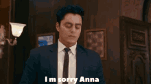 a man in a suit and tie is saying " i 'm sorry anna "