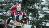 a man in a red and white costume is standing in front of a tree