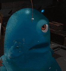 a blue cartoon character has a big eye