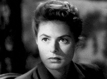 a close up of a woman 's face with a serious look on her face