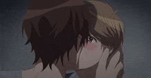 a man and a woman are kissing in a dark room