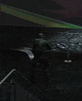 a person with a backpack is walking down stairs