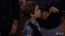 a young boy with his mouth open and the word nooo on his face