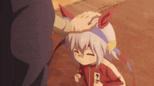 a person putting their hand on a child 's head with a tag that says 9