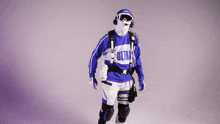 a man wearing a blue and white outfit with the word ultra on it