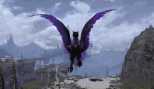 a purple winged animal is flying over a landscape