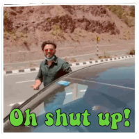 a man standing in front of a car with the words oh shut up written on it