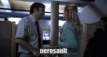 a man and a woman are talking and the woman is wearing a blue sweater that says nerosault on it