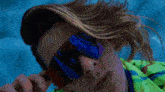 a close up of a person 's face wearing sunglasses