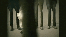 a group of people standing next to each other including a panda