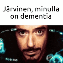 a close up of a man 's face with the words " jarvinen , minulla on dementia " written above him .