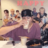 a man wearing a hat with the letter s on it is drinking from a cup