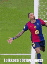 a soccer player is jumping in the air with the words epikkosa obciaga igosa below him