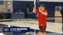 a person on a basketball court with the name # 5 jade melbourne on it