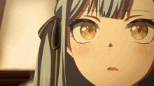 a close up of a girl 's face with brown eyes and a bow in her hair