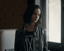 a woman in a black shirt that says path to the pixie