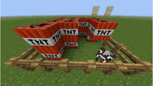 a stack of tnt blocks are surrounded by a fence