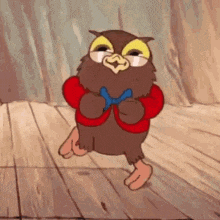 a cartoon owl is standing on a wooden floor wearing a red jacket and a bow tie .