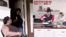a man in a wheelchair next to a woman in a kitchen with chinese writing on the wall
