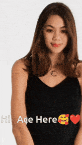 a woman in a black tank top says hi ace here with a heart