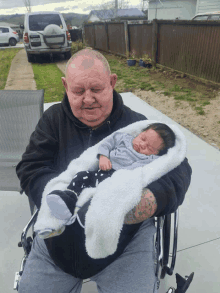 Holding The New Baby GIF