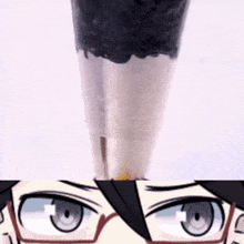 a close up of a person 's face with glasses and a cup in the background