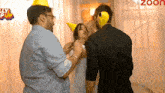 a group of people standing in front of a sign that says bollywood