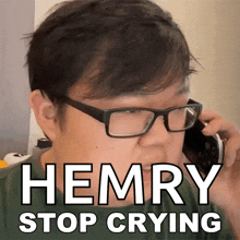 a man wearing glasses is talking on a cell phone with the words hemry stop crying above him