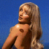 a woman with a tattoo of a kiss on her shoulder
