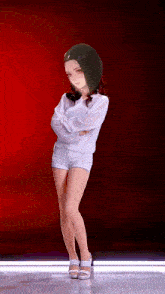 a girl is standing with her arms crossed in front of a red background .