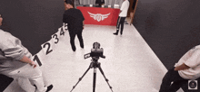 a camera on a tripod with the numbers 1 2 3 4 5 and 6 on it