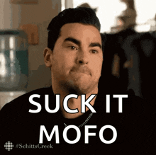 a man says suck it mofo in front of a television