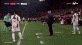 a soccer game is being shown on a television screen
