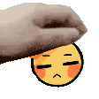 a hand is putting a smiley face on top of a blanket .