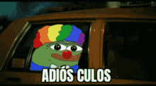 a cartoon of a clown in a car with the words adios culos below him
