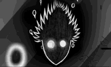 a black and white drawing of a monster 's face with sharp teeth .
