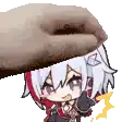 a hand is holding a donut over a cartoon character 's head .
