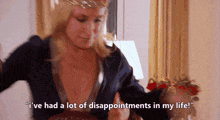 a woman with a crown on her head says i 've had a lot of disappointments in my life
