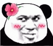 a panda bear with a pink flower in its hair .