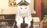 a girl with long white hair wearing a hat and tie is holding a book