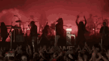 a group of people playing instruments in front of a crowd with a sign that says campbells on it