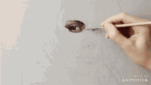 a person is painting a woman 's face with a brush and made in animatica