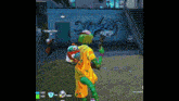 a person in a clown costume is holding a gun in front of a graffiti wall .