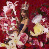 a woman in a crown is surrounded by flowers