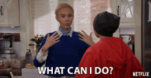 a woman in a blue sweater says what can i do next to a man in a red jacket